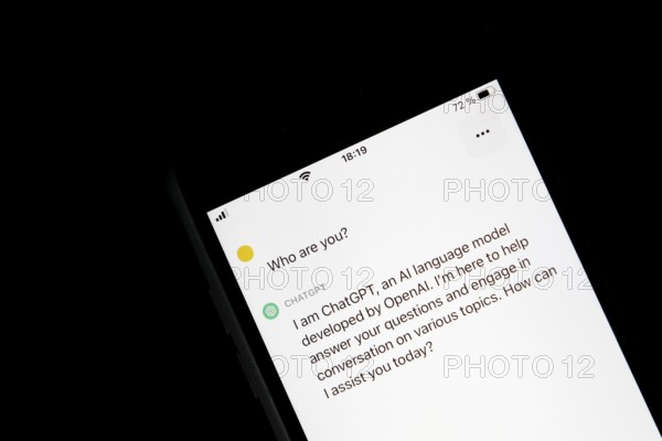 Symbolic image artificial intelligence, detailed view of a smartphone with the app ChatGPT,