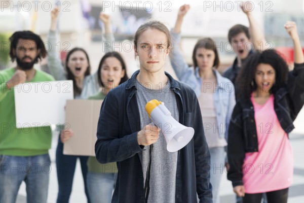 Group people protesting using megaphones