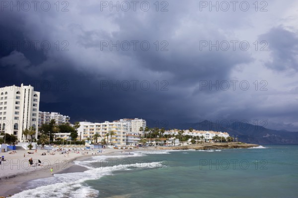 Apartment houses along Costa del Sol sandy beach in resort town of Nerja at the Mediterranean Sea