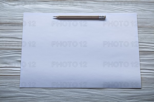 White paper with pencil marks on old wooden panels