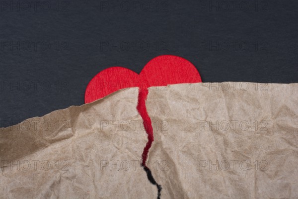 Heart with torn paper for love care concept symbol