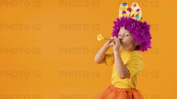 Girl with clown costume copy space