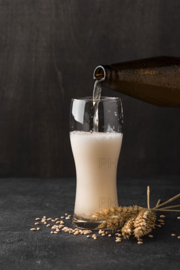 Beer bottle pouring beer glass