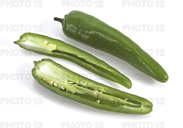 Green chili pepper (capsicum), against white background