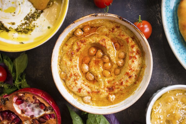 Hummus plate close-up. Hummus, tahini, pitta and buttermilk dip with olive oil. Most famous dishes