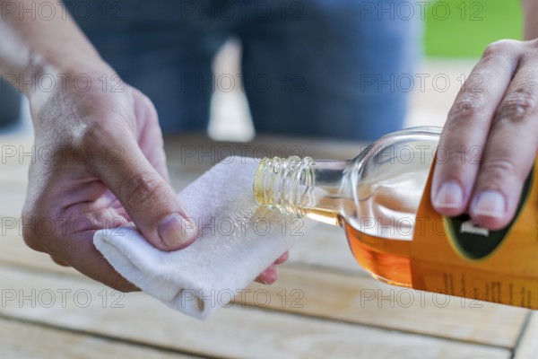 Impregnate wooden table with oil