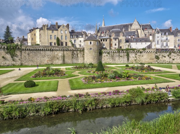 The city walls with the Tour Poudrière tower and the old town in the background. In front of the