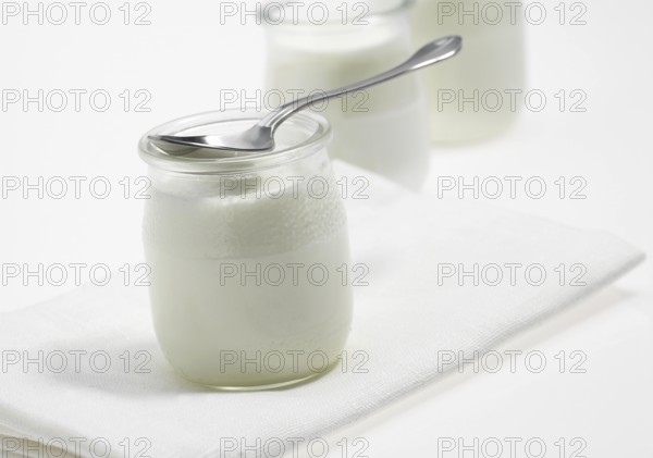 Glasses of Natural Yoghurt against White Background