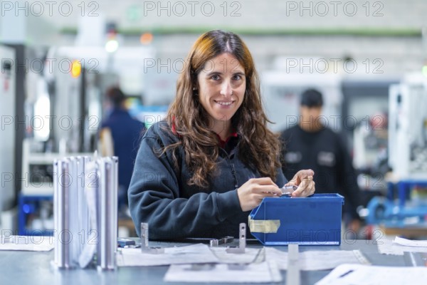 Female engineer working in a cnc factory in the quality control process