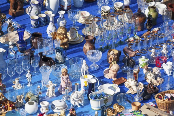 Market stall with porcelain, glasses and figurines at the Bremen flea market Kajenmarkt at