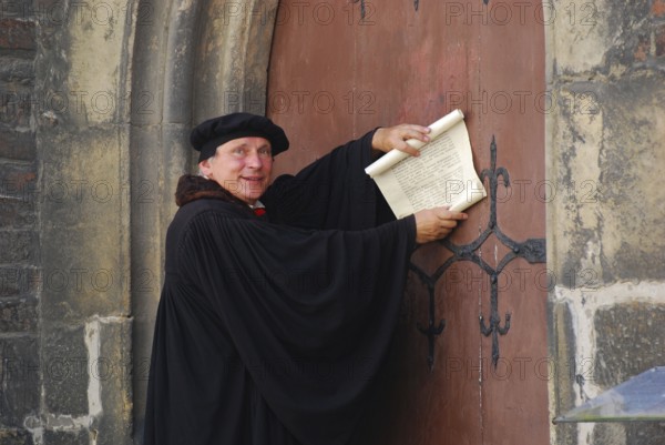 Actors of Martin Luther, in front of church portal, Wittenberg, Saxony-Anhalt, Luther's theses,