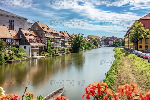 View of a quiet riverside town with traditional architecture and nature, Little Venice Bamberg seen