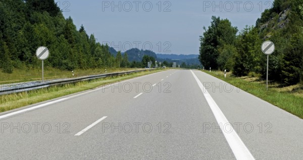Empty Autobahn, freeway, with german traffic signs meaning speed limit cancelled, A 95 near