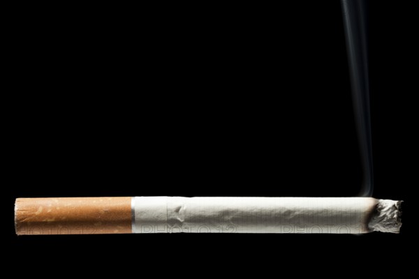 Addiction issue, smoking cigarette black isolated