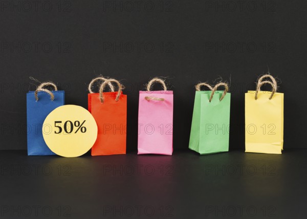 Bright packets with sale label