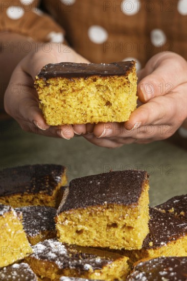Close up hands holding delicious cake