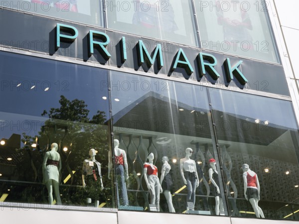 Hannover, Germany - May 7, 2018: Primark logo sign on storefront above shop window mannequins