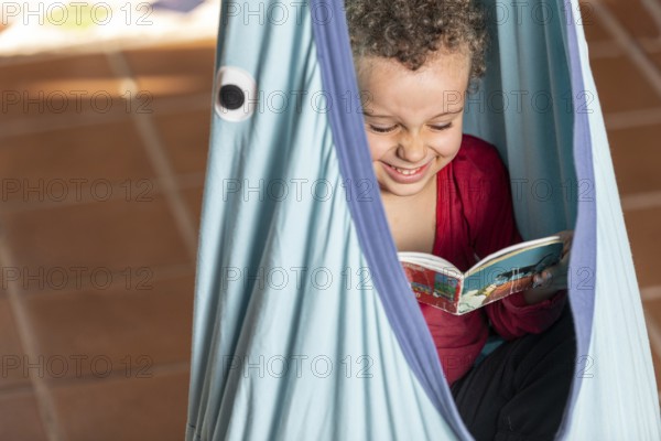 Little boy reading book