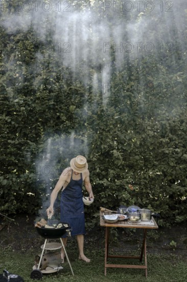Man barbecuing in the garden