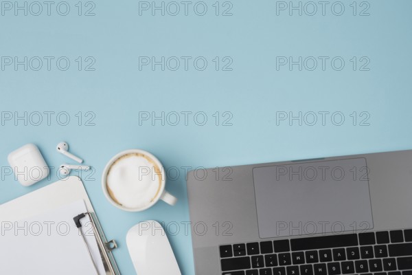 Top view desk with laptop clipboard