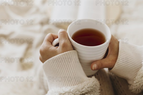 Young woman holding cup tea while enjoying winter holidays. Resolution and high quality beautiful