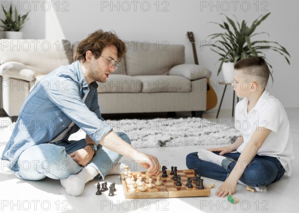 Tutor learning boy how play chess