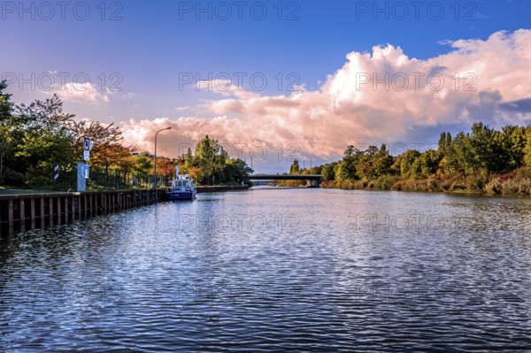 The Mittelland Canal in Hanover in the district of Vahrenwald in sunshine, white clouds and blue