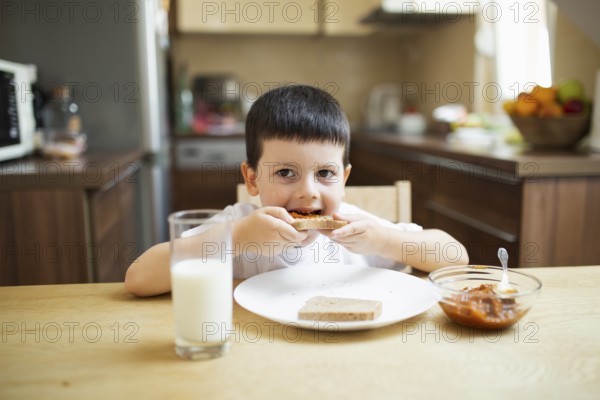Baby boy having breakfast home