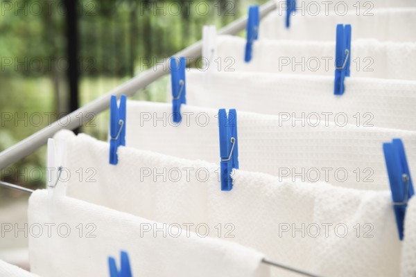 White towels drying clotheshorse