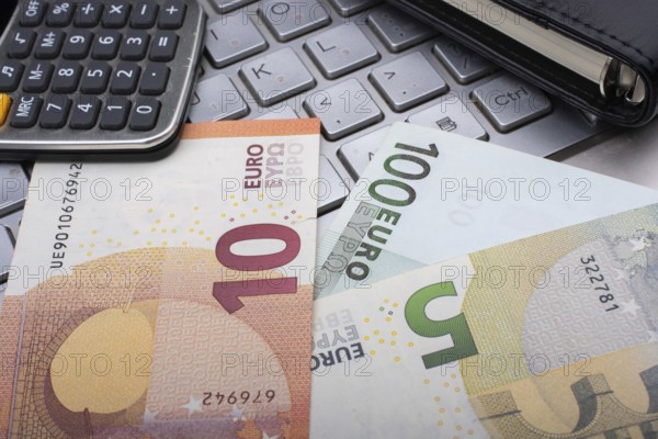 Euro banknotes, calculator Business and finance concept