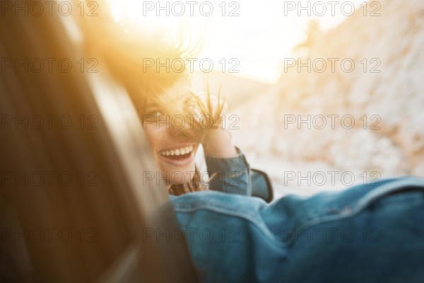 Woman smiling while being car ride