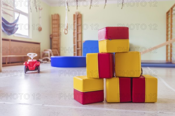 Close up of toy foam cubes in a gym hall of a Kindergarten