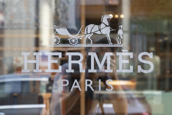 Close-up, logo of the French luxury fashion brand Hermes on a boutique in the shopping street Neuer