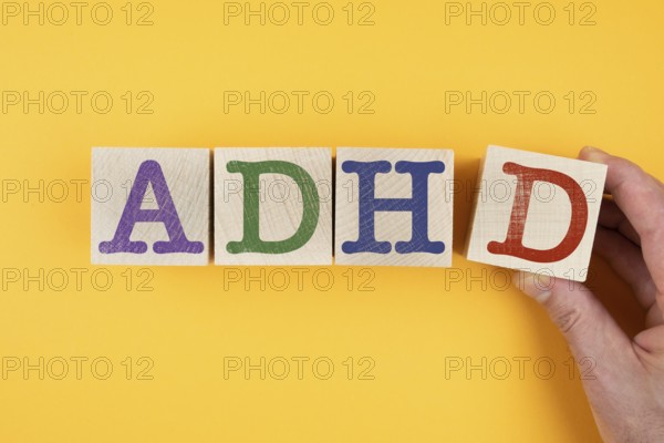 letters ADHD on wooden blocks, Attention Deficit Hyperactivity Disorder concept