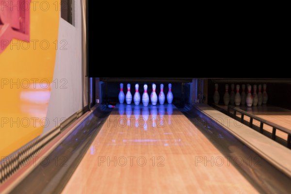 Low view bowling alley with wooden flooer