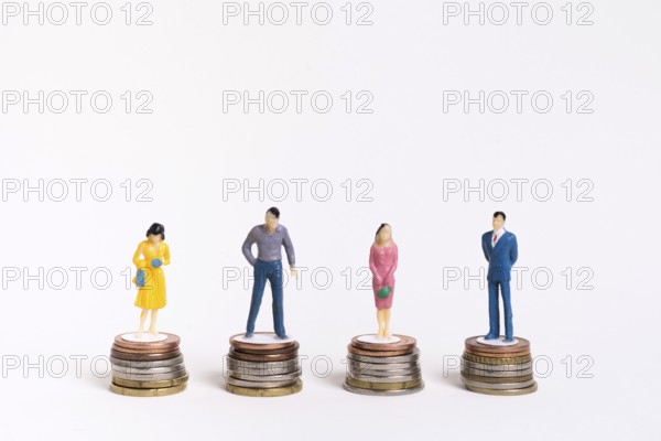 Business man woman sitting equal piles coins