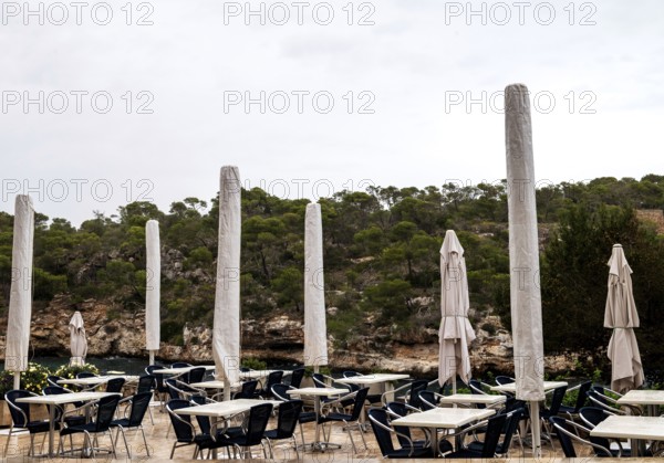 Empty restaurant terrace in the low season in Cala Figuera near Santanyí, Majorca, Balearic