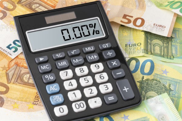 calculator showing zero percent interest rate on Euro banknotes, cheap borrowing concept