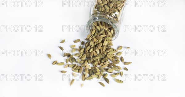 Cardamom (elettaria Cardamomum), spice falling against White Background