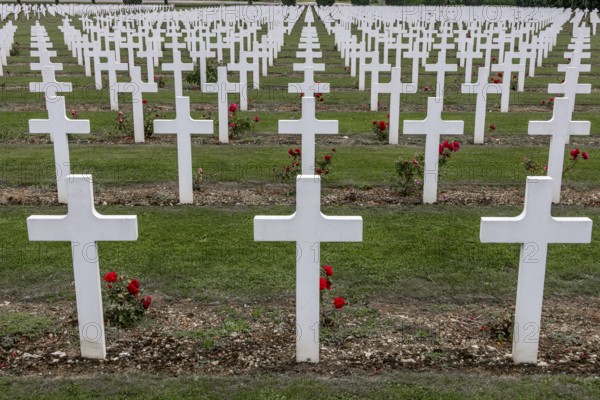 French military cemetery at the Ossuaire de Douaumont with white graves and crosses of fallen