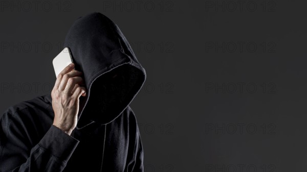 Side view male hacker talking smartphone with copy space, Resolution and high quality beautiful