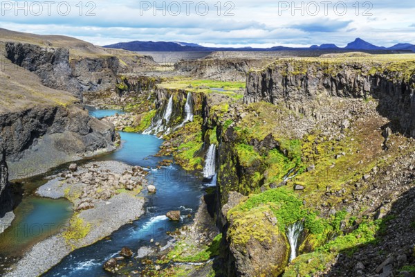 View of waterfalls in Sigoldugljufur canyon and the blue river in Highlands of Iceland in summer