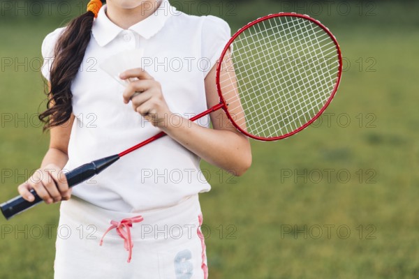 Mid section girl holding shuttlecock badminton hand