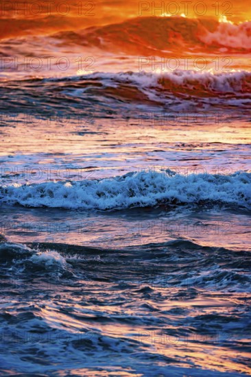 Sunset with high waves at the sea with psychedelic colours, Portbail, English Channel, Cotentin,
