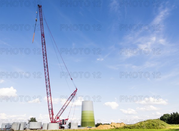 Huge crane for building a windmill at a construction site