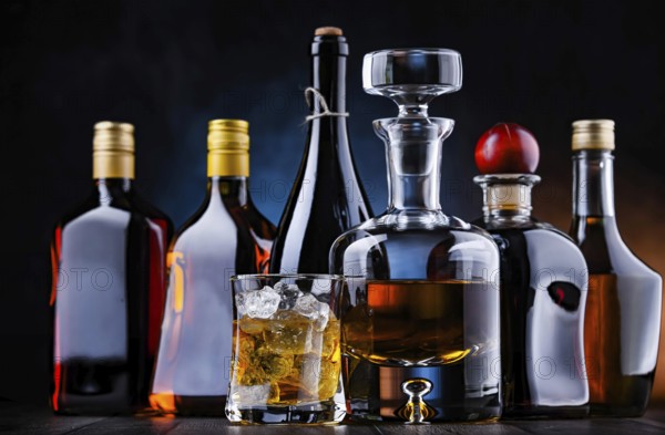 Composition with bottles of assorted alcoholic beverages