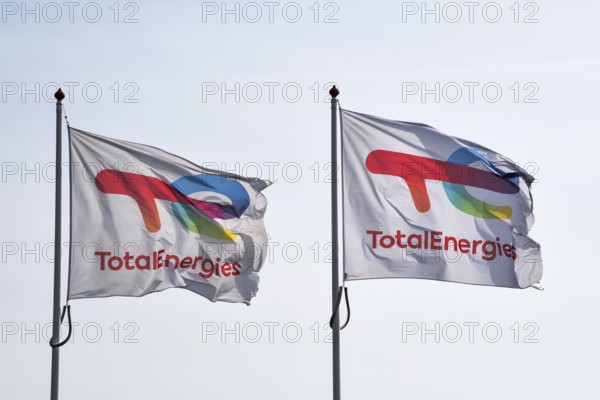 Den Helder, Netherlands. May 2, 2023. Flying flags of Total Energies, a major oil company