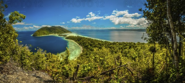 Clear blue sea with wilderness and greenery of Kri island in Raja Ampat in West Papua, Indonesia.