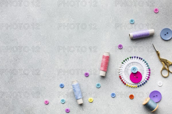 Arrangement colourful sewing threads buttons