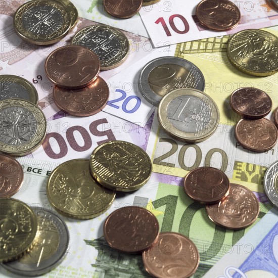 Euro Coins on 10, 20, 100, 200, and 500 Euro Bank Notes